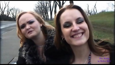 pair buddies are waiting for the bus and one of them accepts some money to bang in the woods